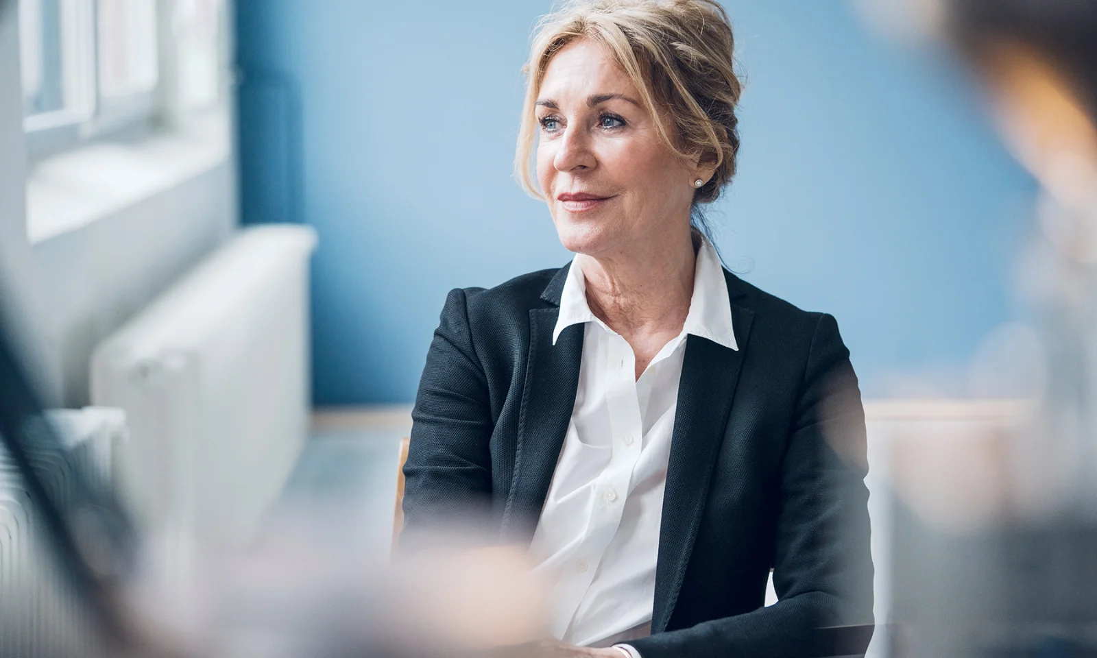 Senior executive in a thoughtful business setting smaragd-key-visual-money-laundering-with-smaragd.jpg